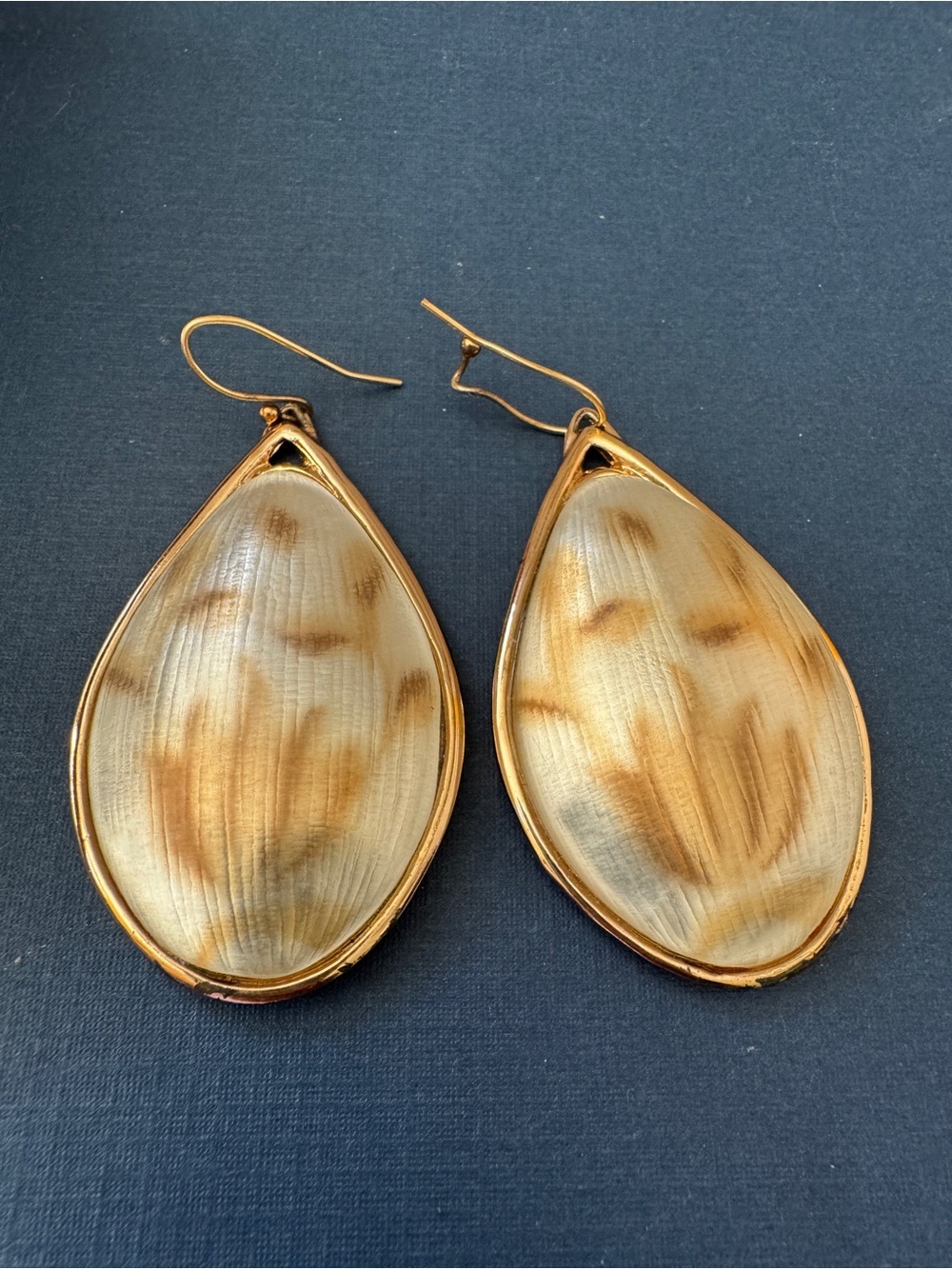 Alexis Bittar Gold Lucite Teardrop Earrings in a warm champagne-gold lucite drop